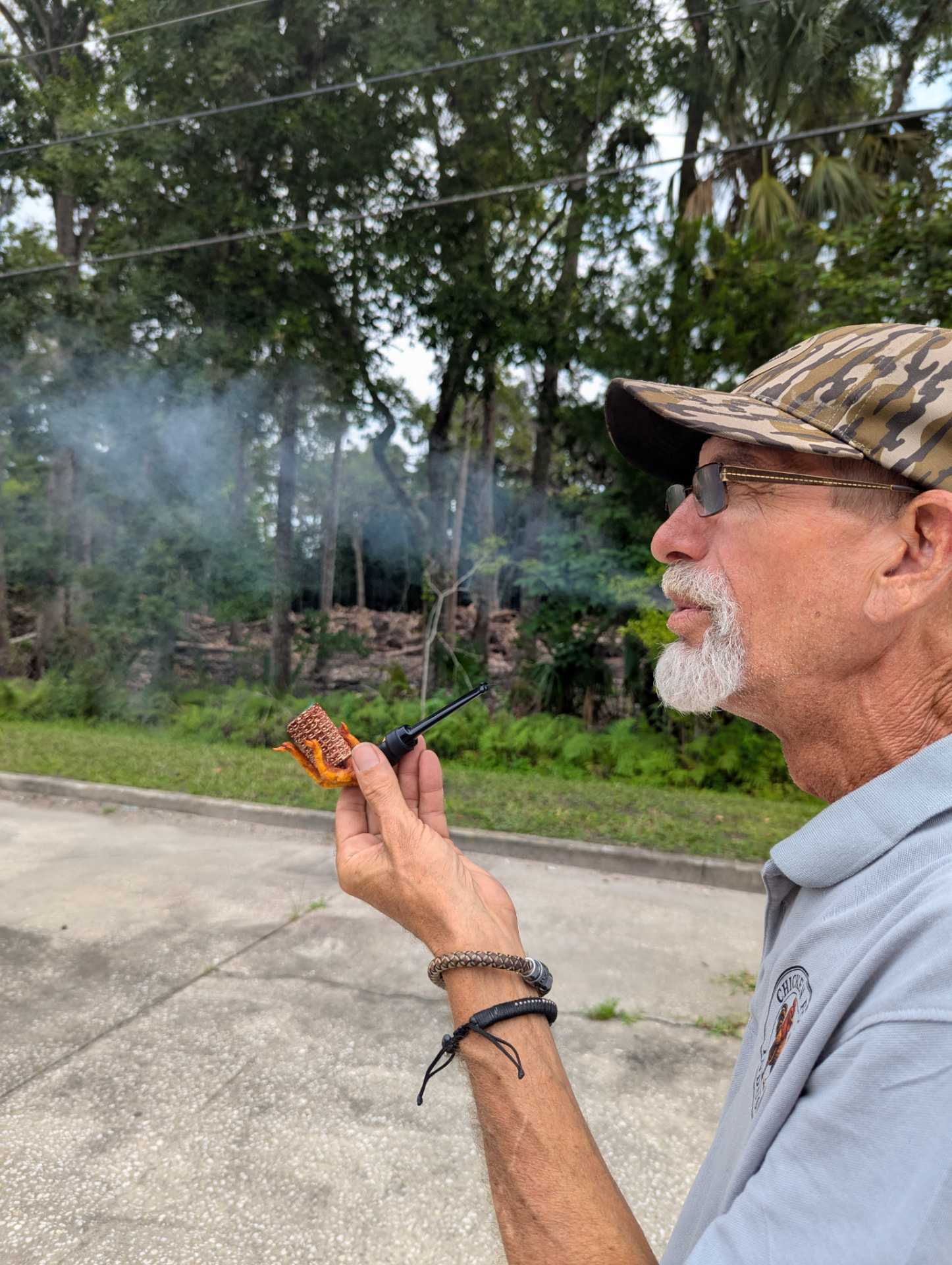Chicken Foot Industries founder smoking a handmade chicken foot pipe in Florida